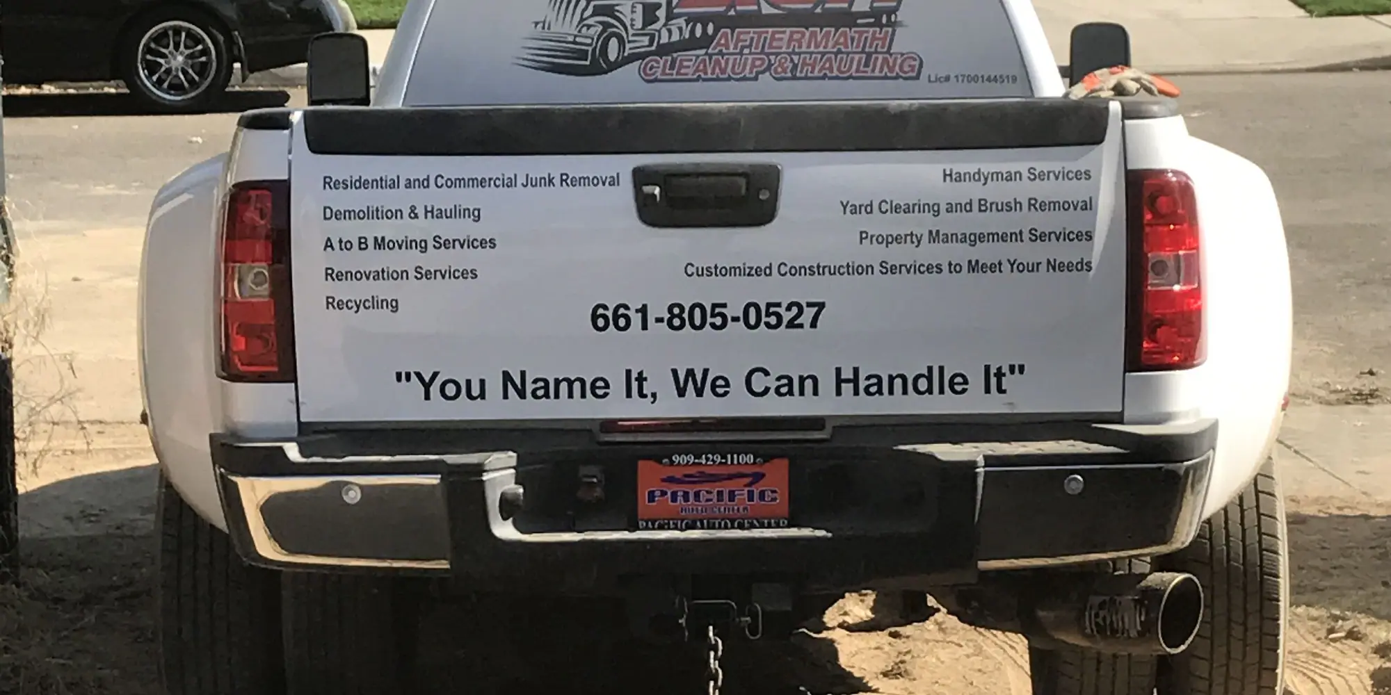 An Aftermath Cleanup & Hauling company truck on a Bakersfield job site